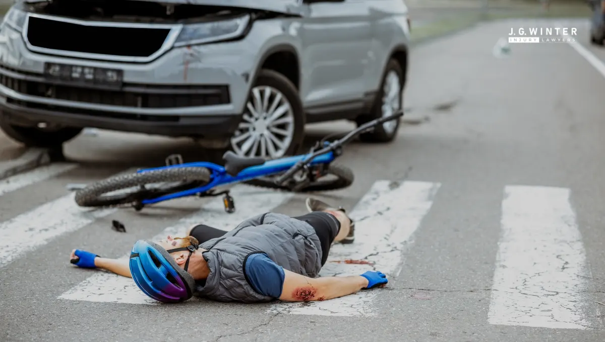 A bicyclist hit by a vehicle